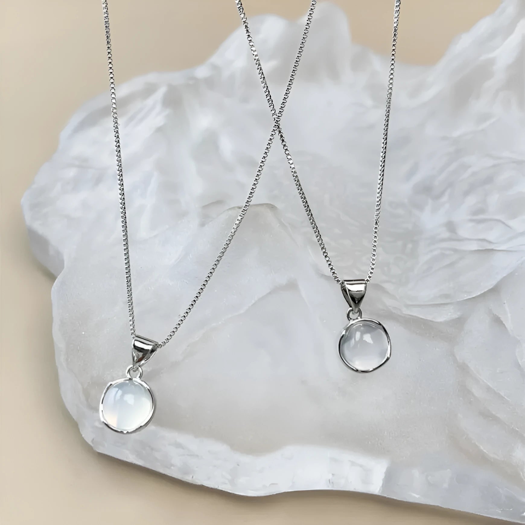 Korean-style oval pendant necklace with geometric eight-point star charm on an adjustable box chain.