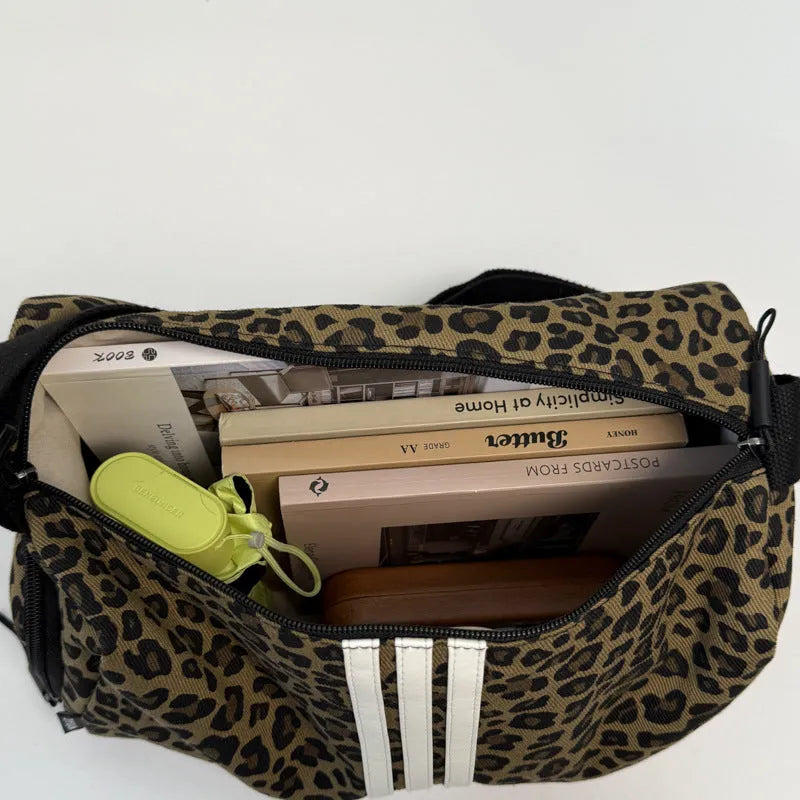 Sports style shoulder messenger bag in leopard print or stripes pattern with crossbody strap