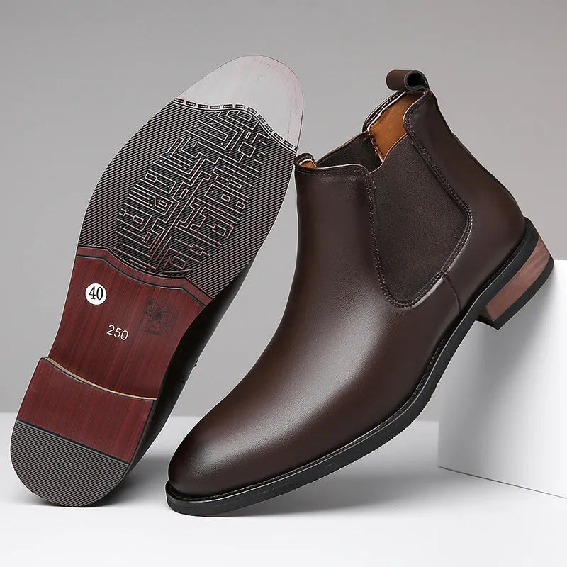 Men's black and light brown pointed toe Chelsea boots with a high-top design and rubber sole.