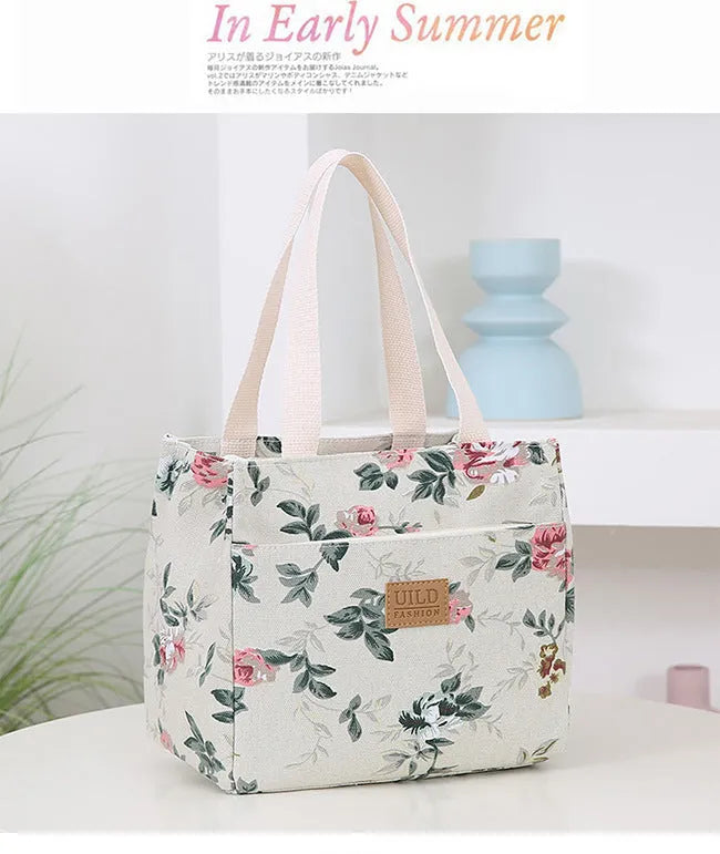 Women's printed canvas handbag with floral design and aluminium hardware in square shape