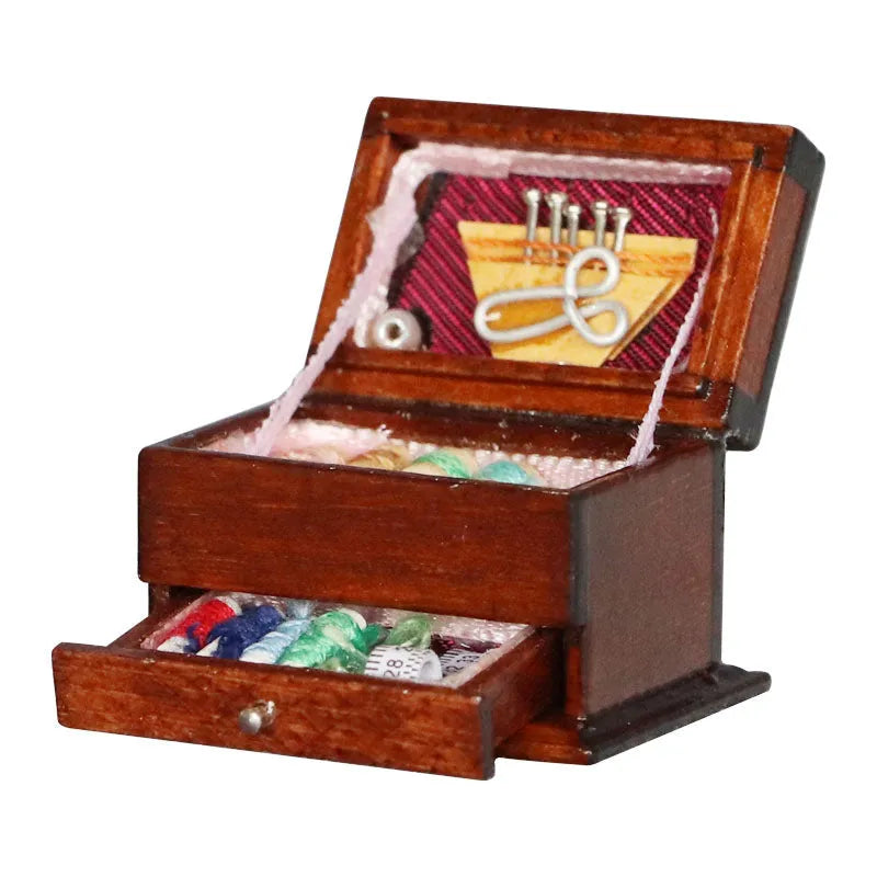 Miniature wooden vintage sewing machine sewing kit with double layer colour design on a white background.