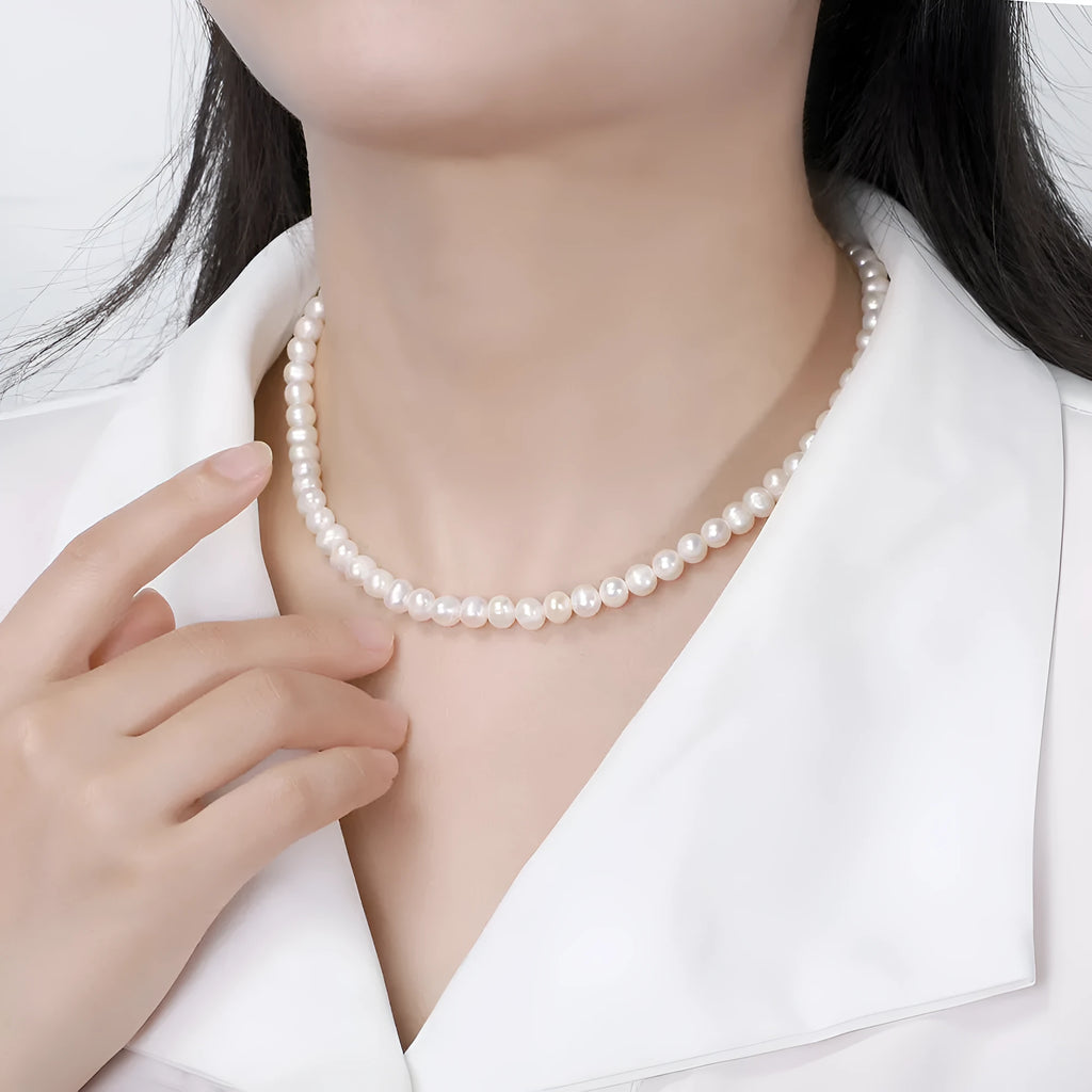 Women's sterling silver necklace with a 6-7mm freshwater pearl on an adjustable chain.