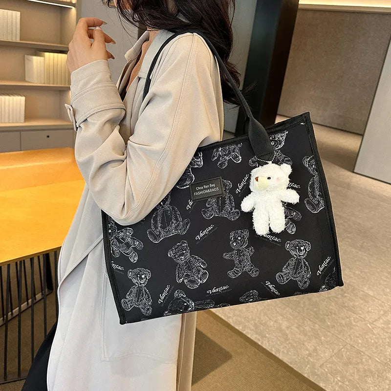 Women's black and white canvas tote bag with rhombus pattern and sandwich pocket design