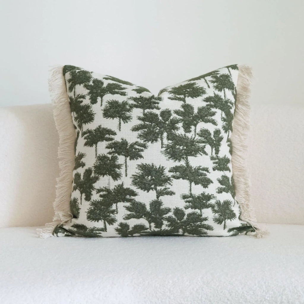 Green botanical pattern hotel sample pillow with tassel detail on linen cotton cover