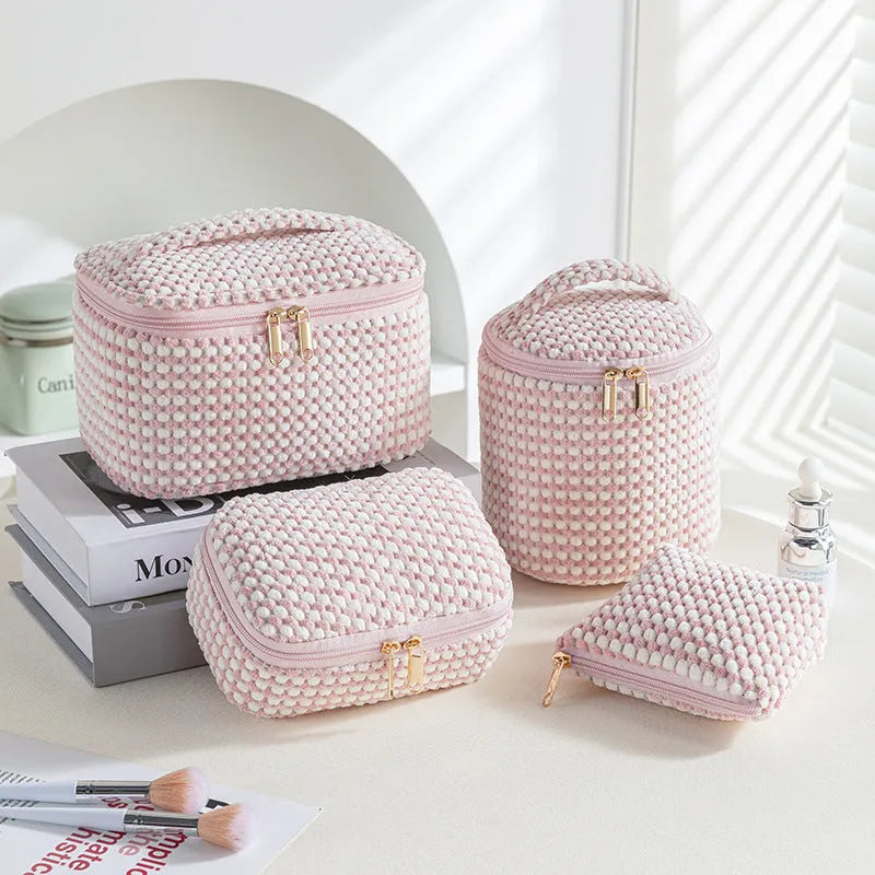 Four cube-style polyester makeup bags in pink, khaki, pink dots, and blue with dots colour options