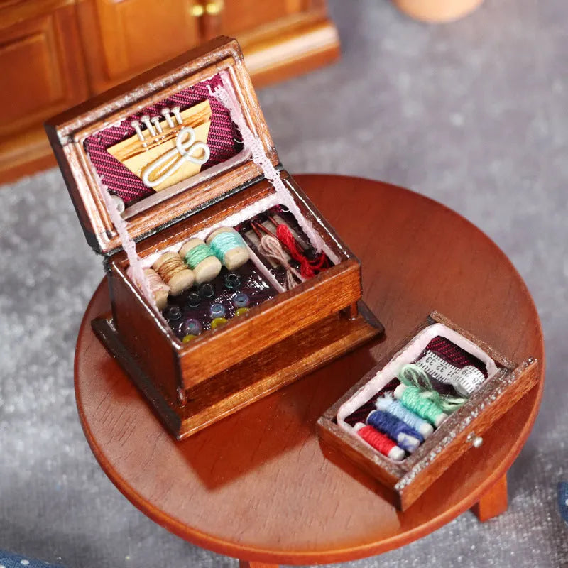 Miniature wooden vintage sewing machine sewing kit with double layer colour design on a white background.