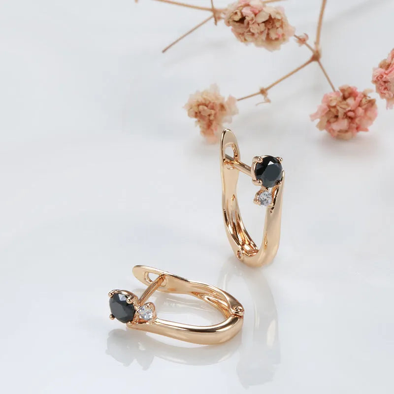 Gold drop earrings with black geometric stones in retro style design