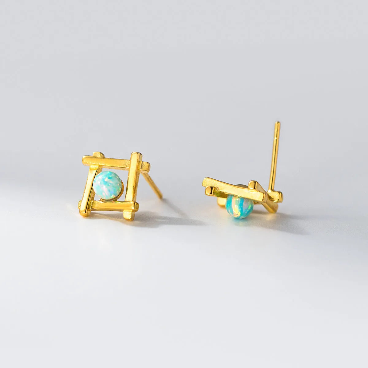 Women's geometric cross quadrangle stud earrings in sterling silver with gold or silver plating options