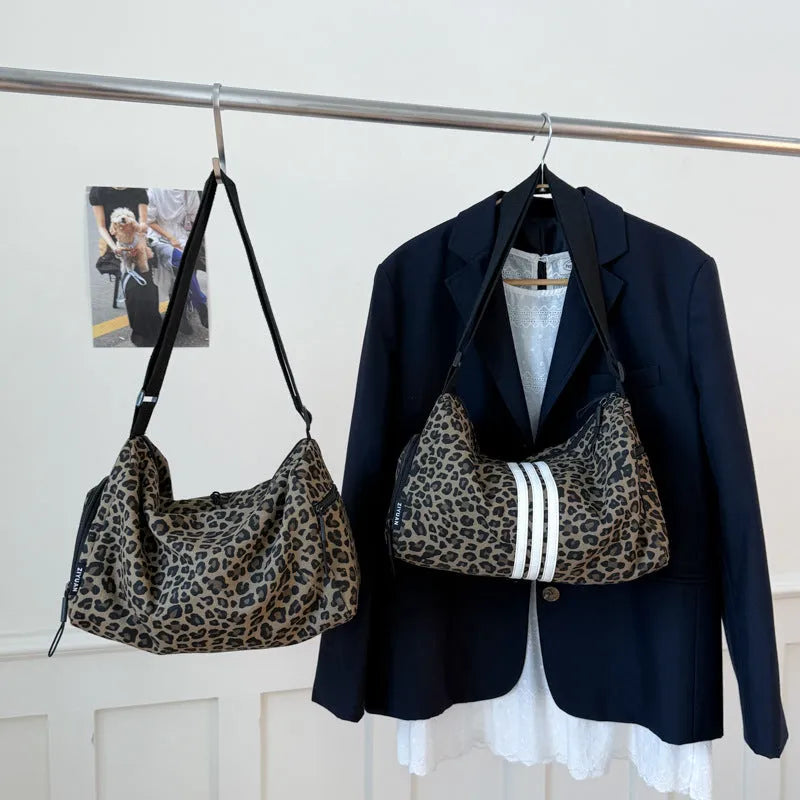 Sports style shoulder messenger bag in leopard print or stripes pattern with crossbody strap
