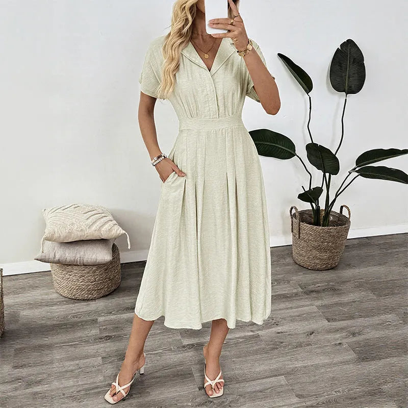 Light green commuter shirt dress with lapel collar and waist-tight fit