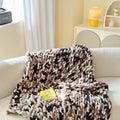 Thick striped chenille cover blanket folded to show texture and colour options including caramel mango and purple.