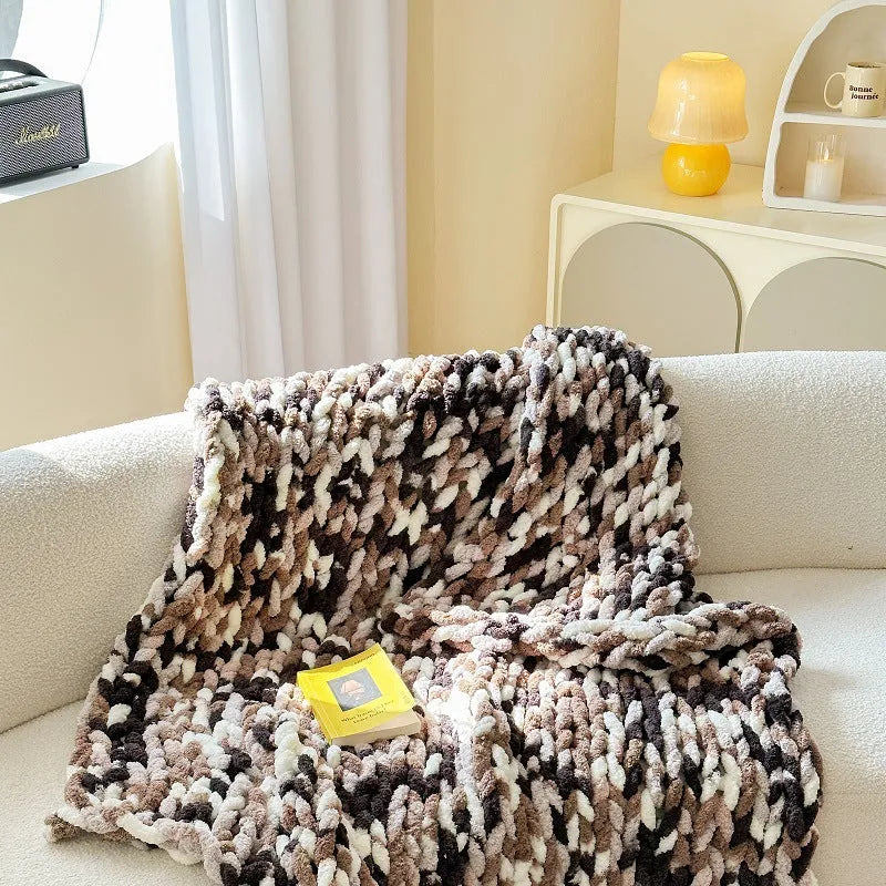 Thick striped chenille cover blanket folded to show texture and colour options including caramel mango and purple.