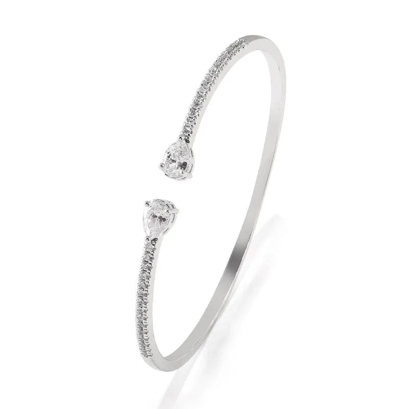 Copper bracelet with multi-zircon inlay in simple style, shown in white and blue colour options.