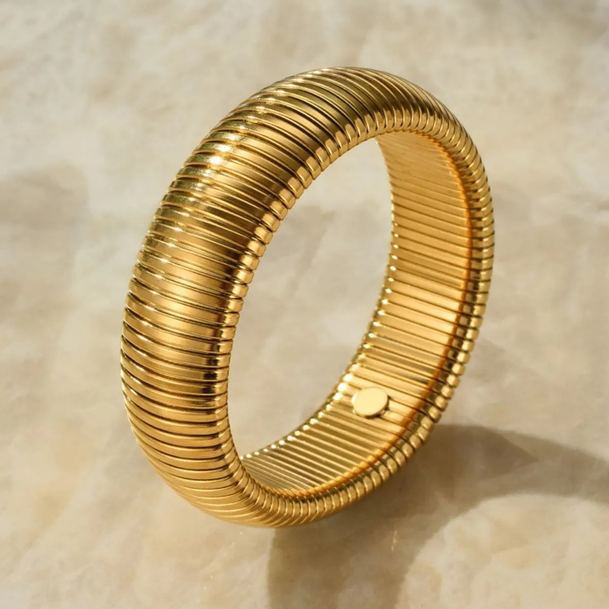 Women's elastic titanium steel bracelet with vertical stripe ring pattern in gold finish