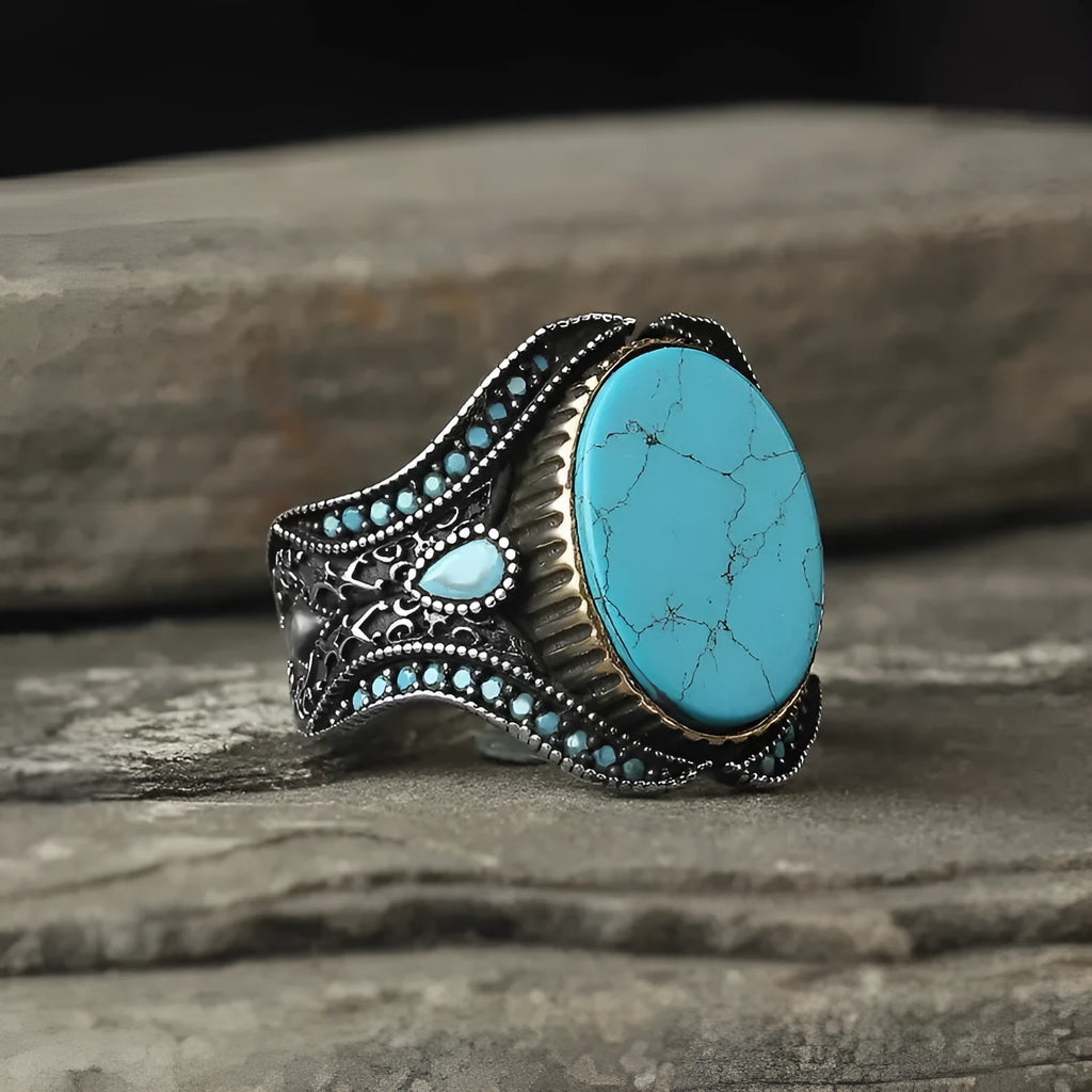Men's antique silver alloy round band ring showing simple turquoise colour on finger