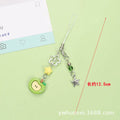 Plastic resin fruit phone charm keychain with strawberry design on white rope cord