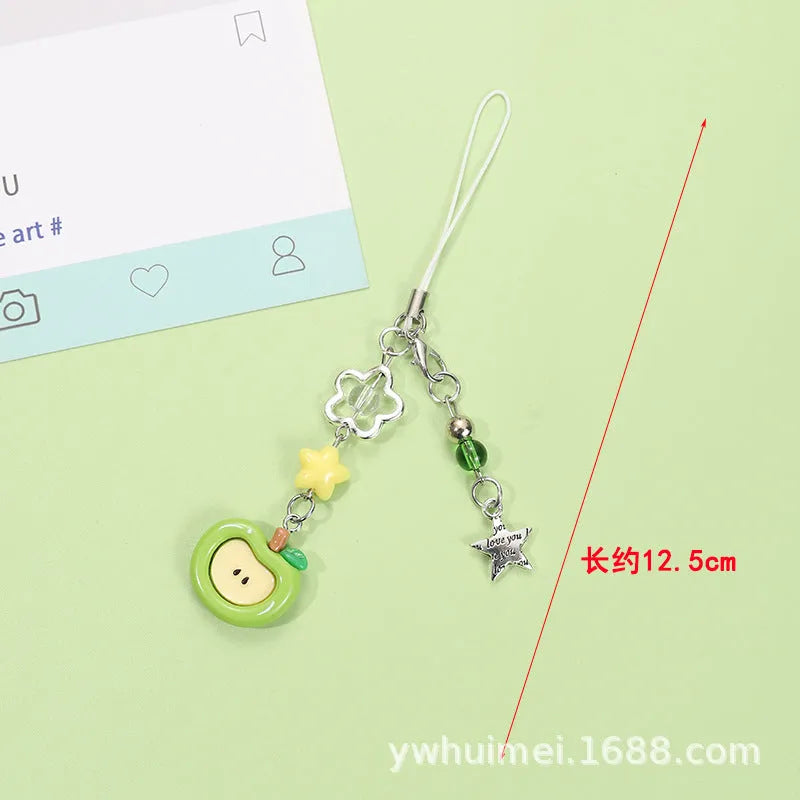 Plastic resin fruit phone charm keychain with strawberry design on white rope cord