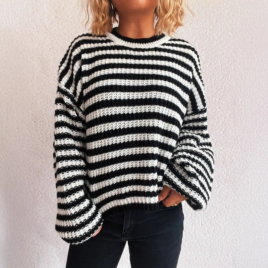 Woman wearing a vintage striped loose-fit pullover sweater in a khaki colour.