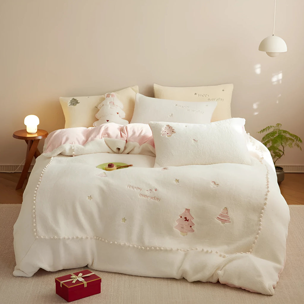 Milk fibre bedding four-piece set with green Christmas tree pattern on duvet cover, sheet, and pillowcases.