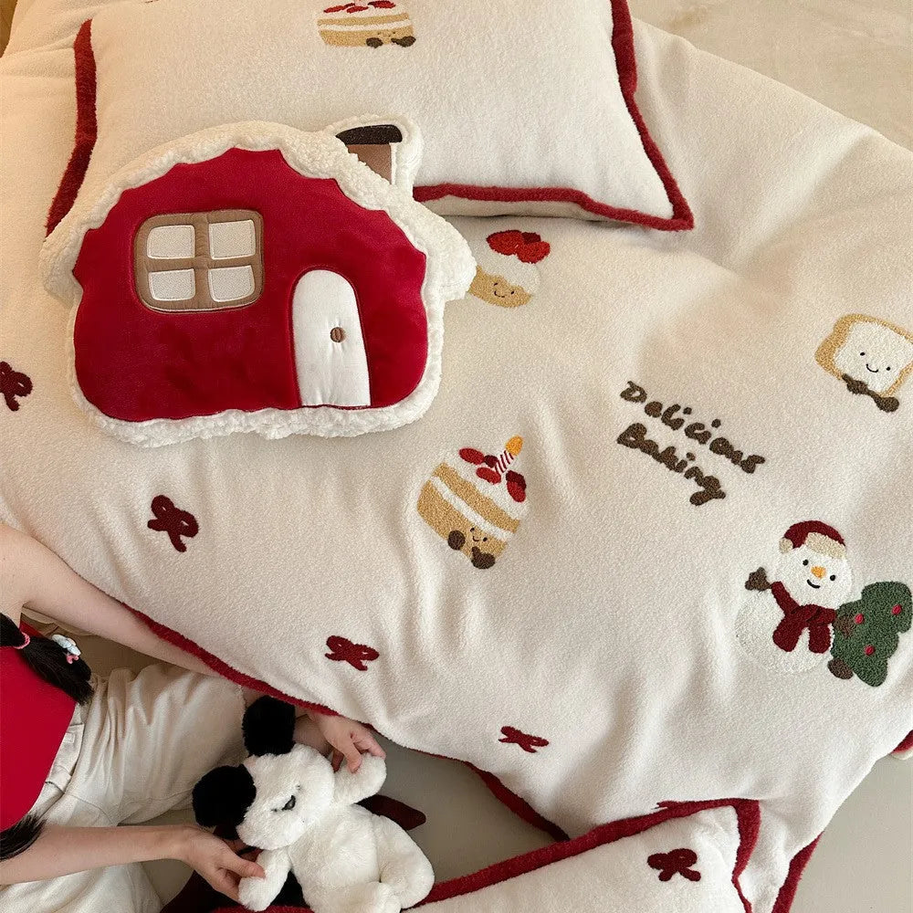 Christmas cartoon bedding four-piece set showing bed sheet, duvet cover and pillowcases with pastel milk cake pattern