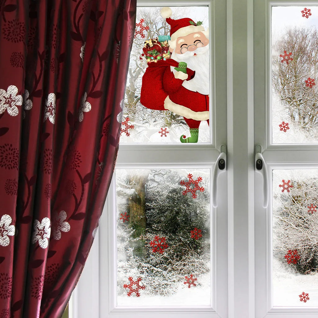 Static PVC wall sticker with snowflake and Santa Claus design, 27x40cm, on a window showcase