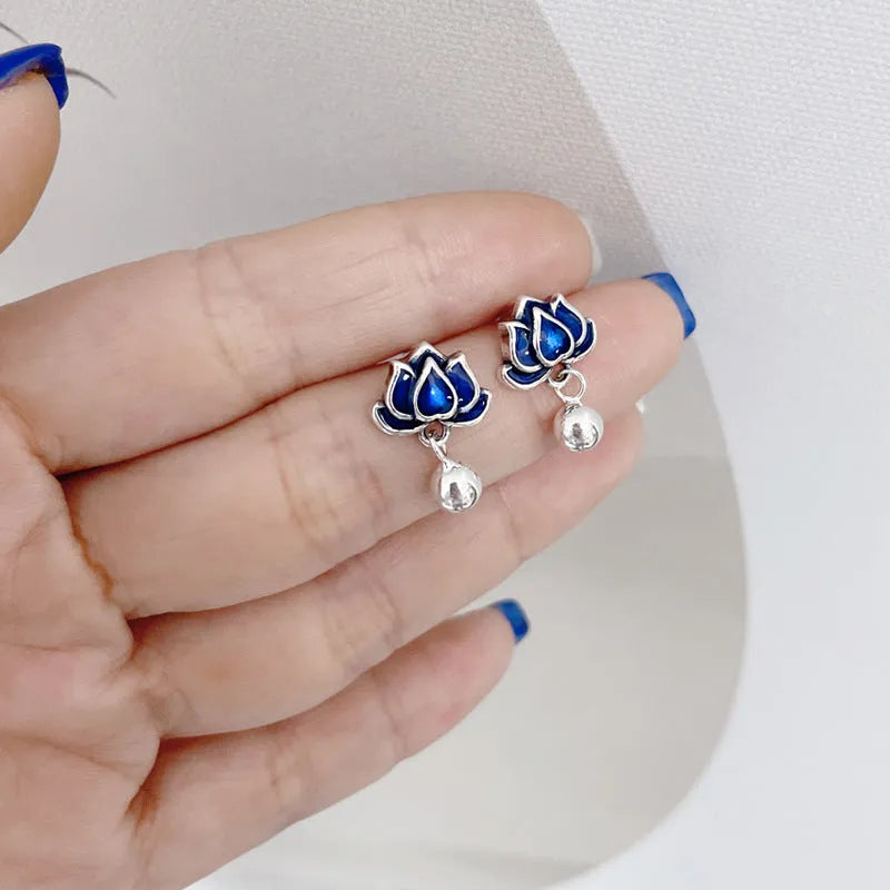 Blue lotus seedpod tassel stud earrings with flower shape, measuring 1.2cm wide.