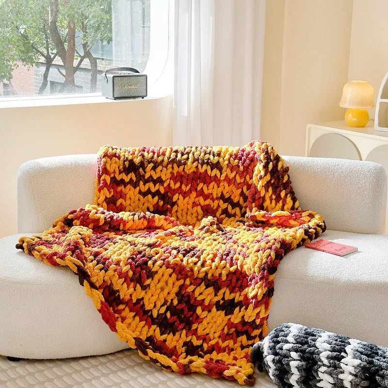 Thick striped chenille cover blanket folded to show texture and colour options including caramel mango and purple.