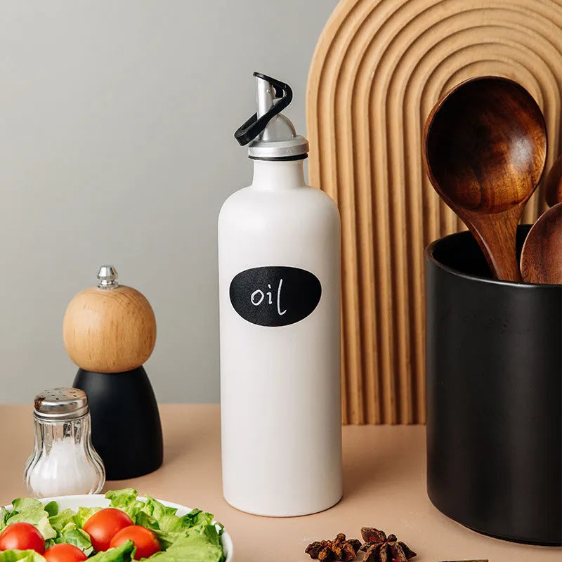 Ceramic oil pot with funnel in black, coffee, and white colour options, 650ml capacity.
