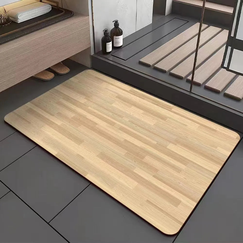 Square diatomite bathroom floor mat with wood grain geometric pattern in a bathroom setting.