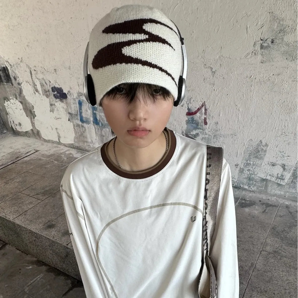Medium-sized acrylic beanie hat for men and women in black colour showing knit texture