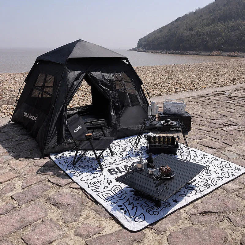 Thickened outdoor picnic mat in Night Black on grass, 200x200cm polyester fibre moisture-proof ground cover