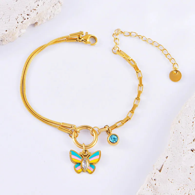 Gold coloured titanium steel necklace and bracelet set with colourful epoxy butterfly pendant