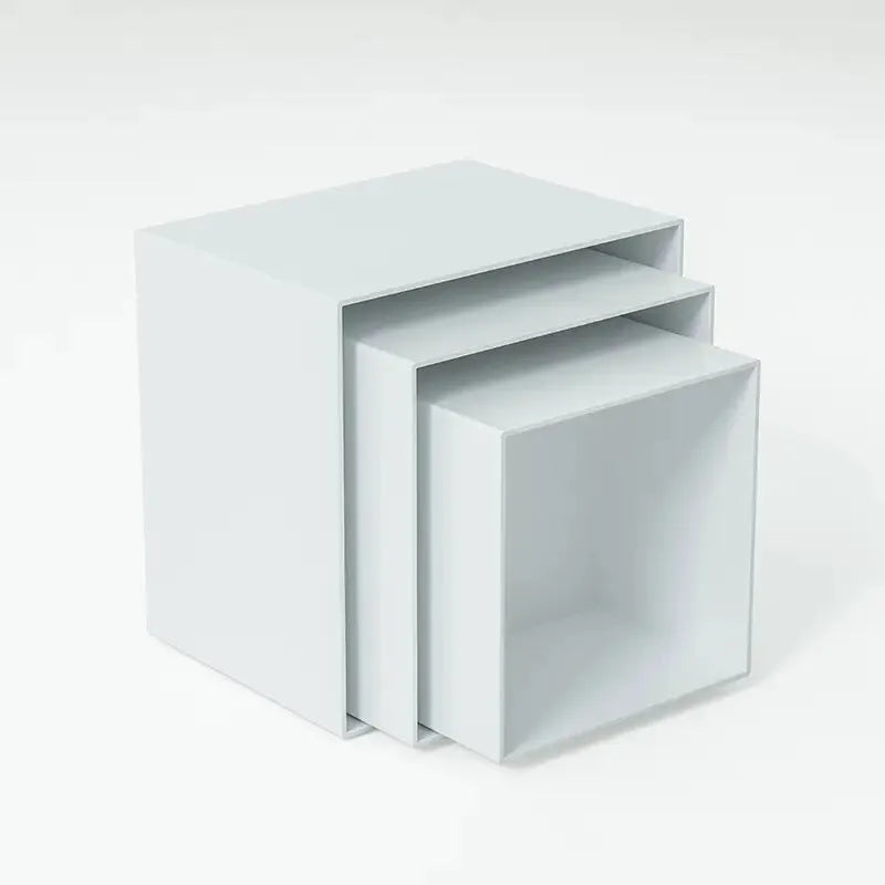 Six identical white plastic cube dessert display stands arranged together.