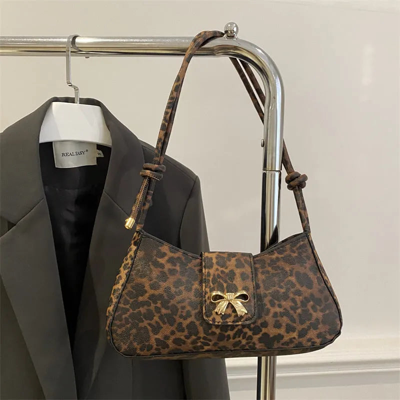Women's casual PU handbag with sandwich pocket in brown colour showing 27cm dimensions