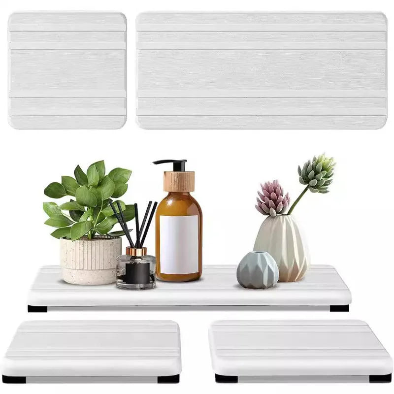 Set of three square diatomaceous earth bathroom draining pads in solid colours