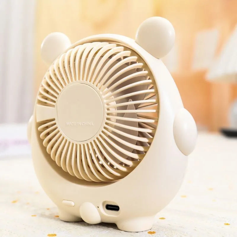 Desktop USB electric fan with cute dog design showing six colour options including bear brown and pink puppy variations