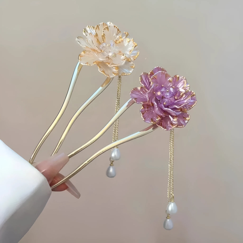Close-up of a retro-style alloy U-shaped hairpin with a detailed purple peony flower and tassel design.
