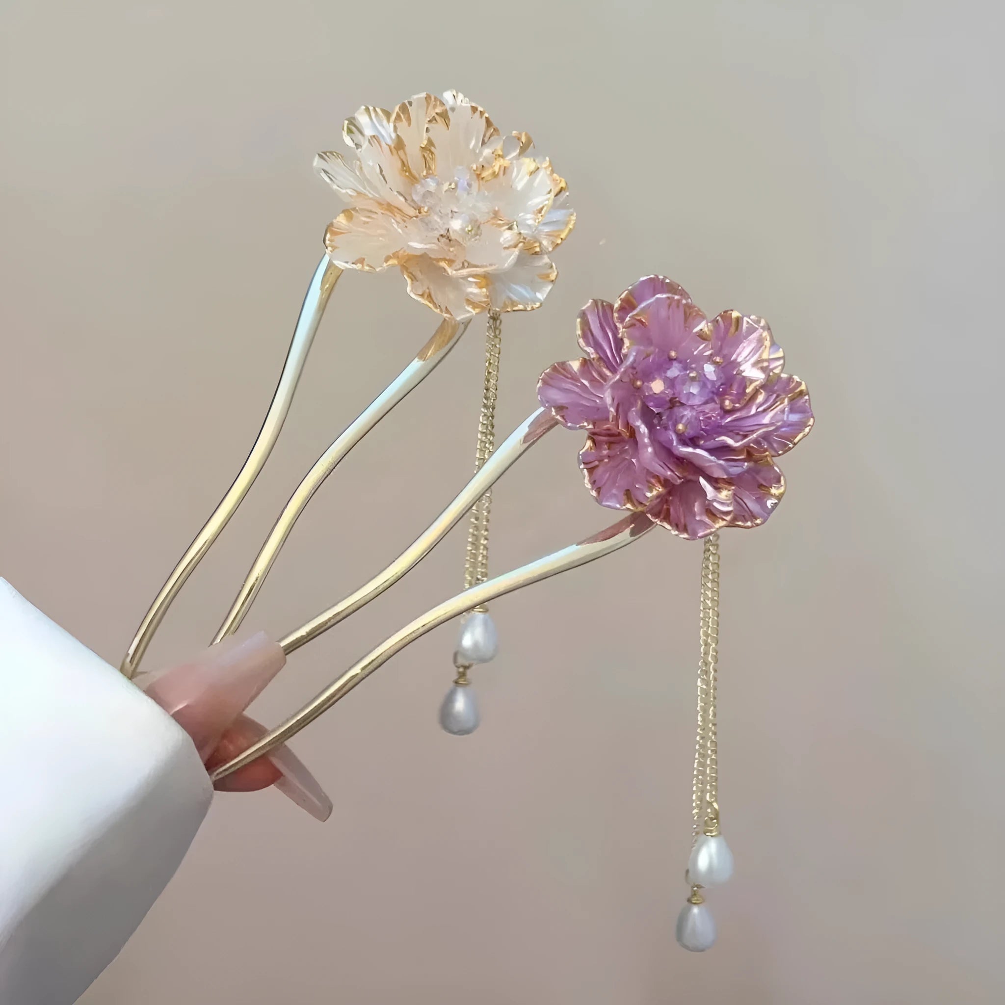 Close-up of a retro-style alloy U-shaped hairpin with a detailed purple peony flower and tassel design.