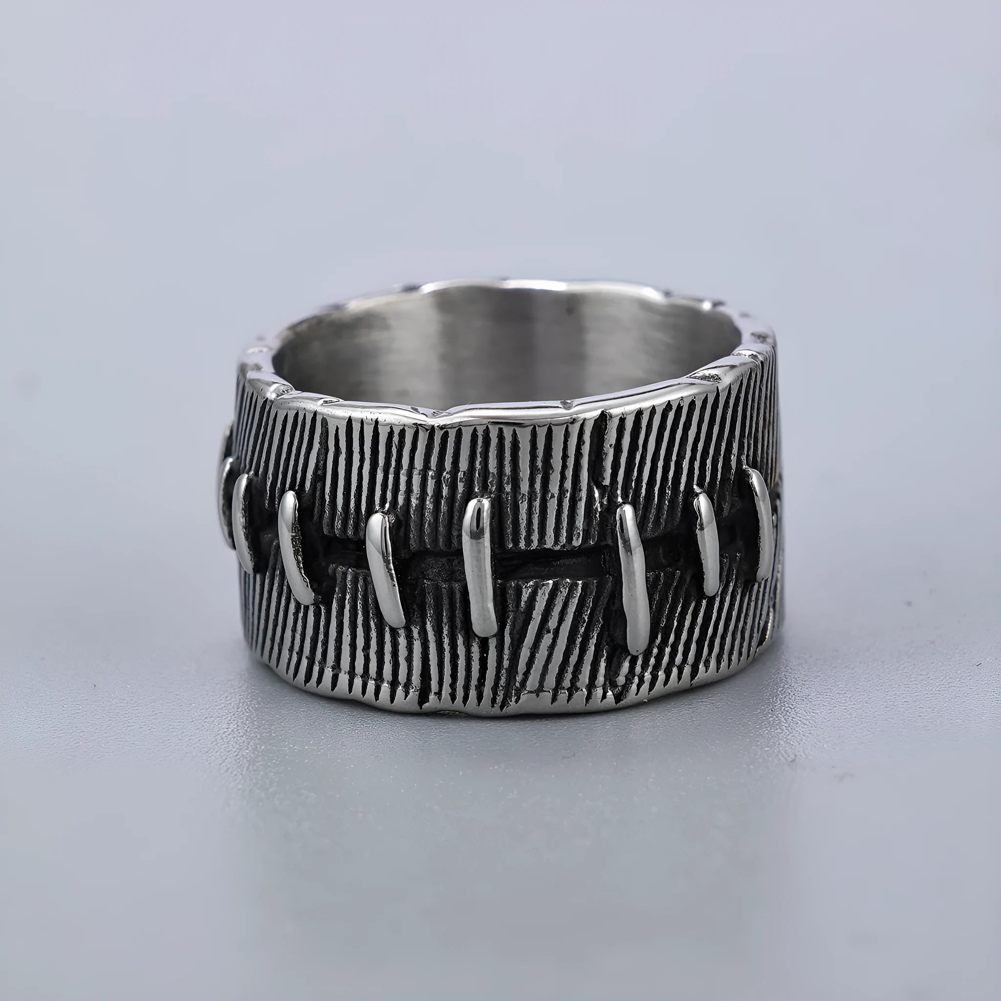 Titanium steel dark punk geometric U-shaped double ring in a retro colour on a size chart.