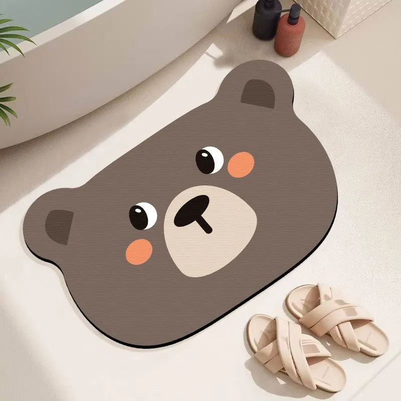 Diatomite bathroom absorbent mat in a cartoon animal design on a bathroom floor.