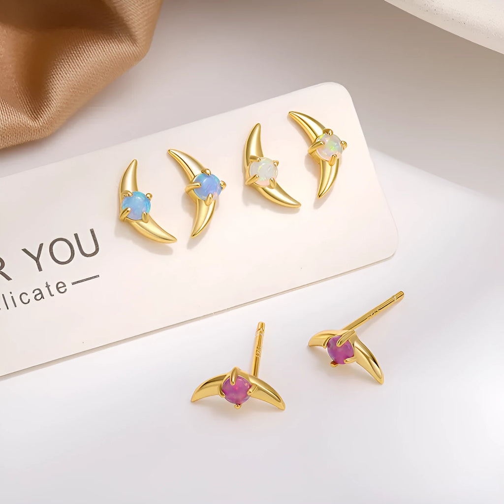 Geometric women's earrings in 925 silver with gold or platinum finish and blue, purple, or white stone.