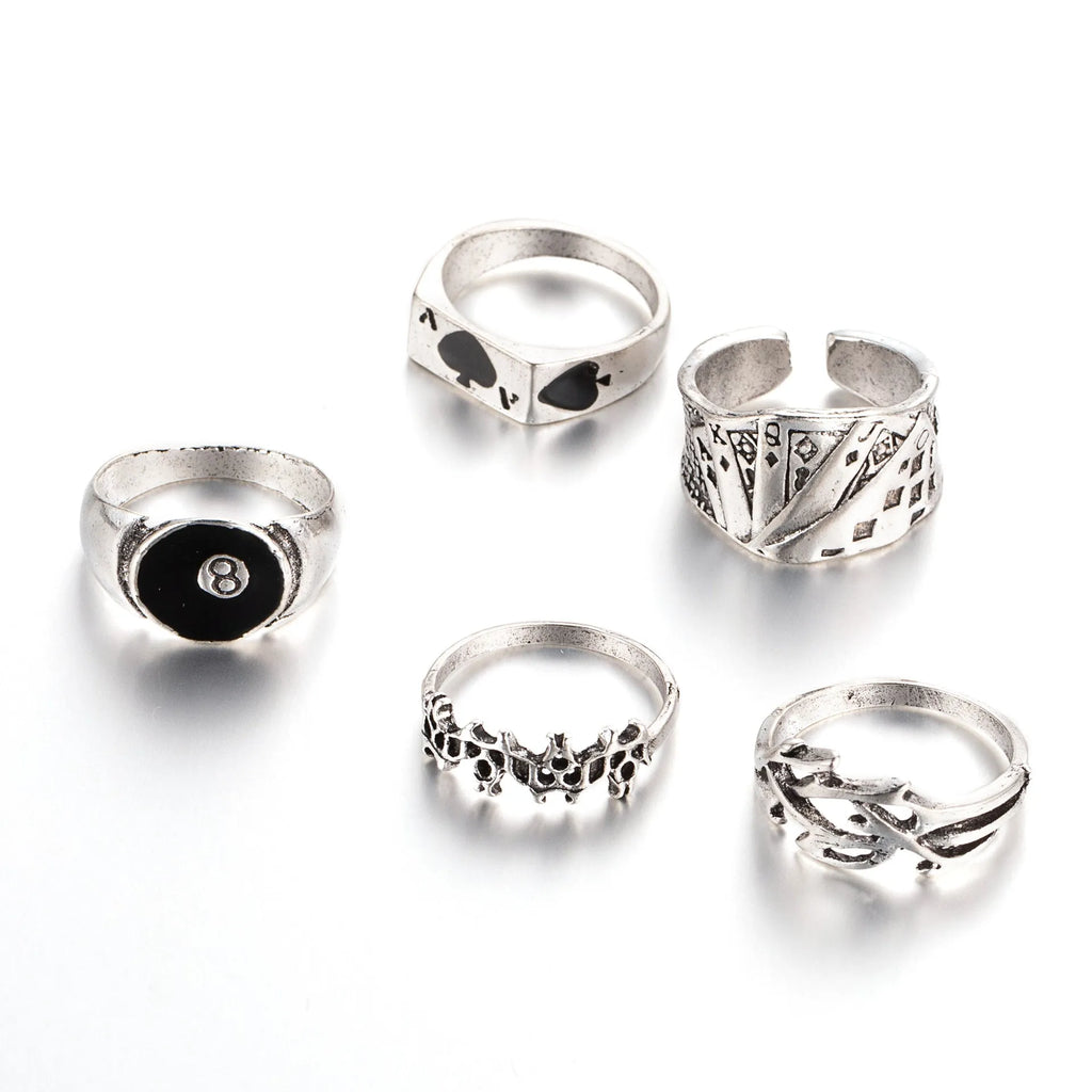 Black alloy poker ring with a large spade design and adjustable band.