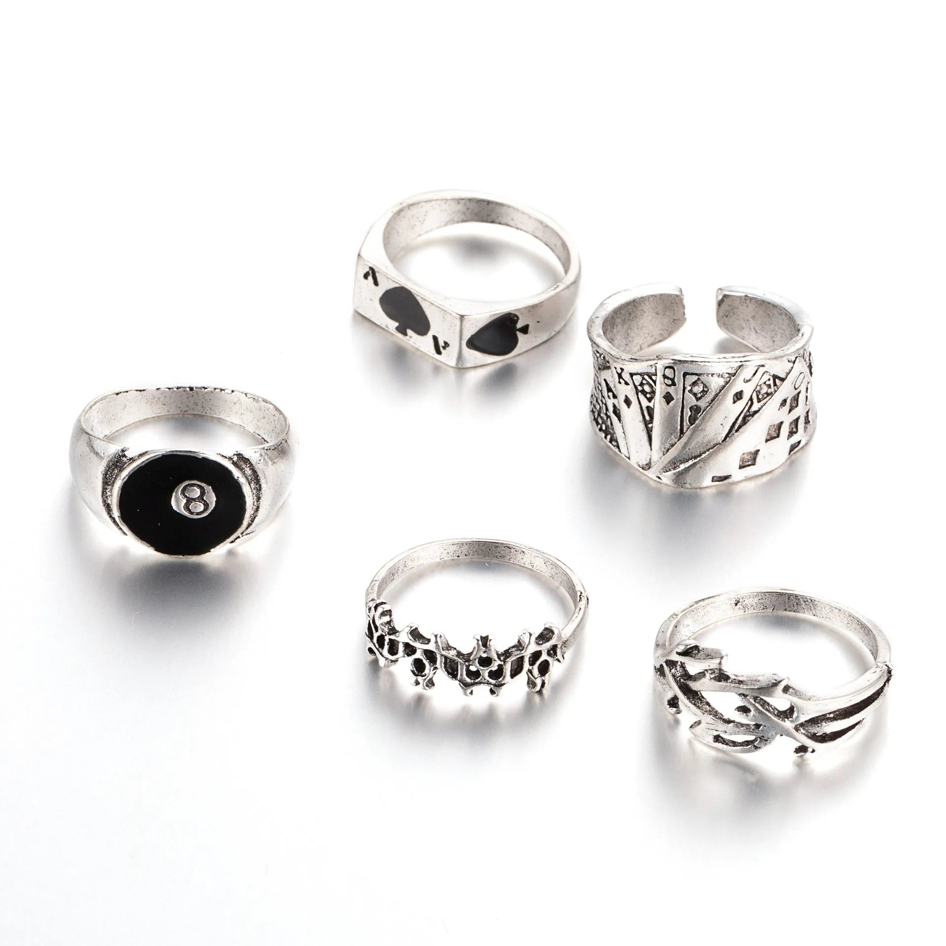 Black alloy poker ring with a large spade design and adjustable band.