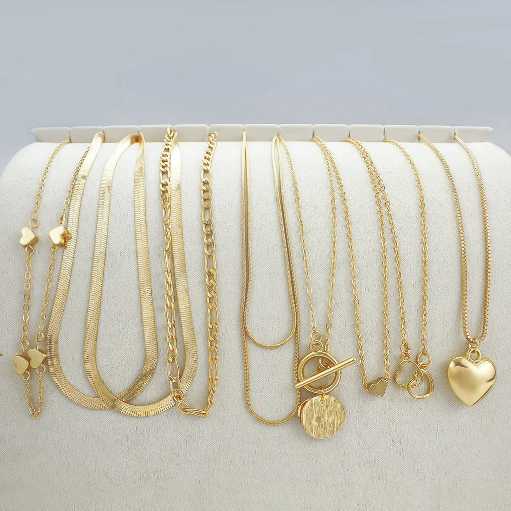 Gold necklace set with ten alloy pendants on adjustable snake bone chain