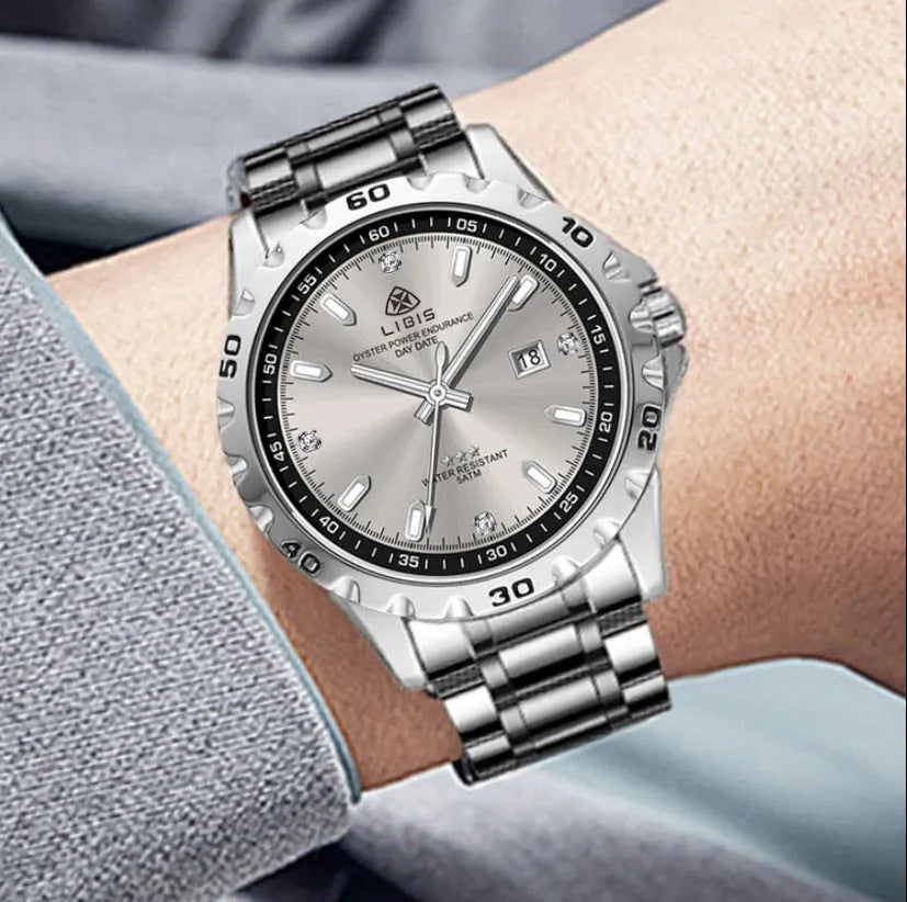 Men's silver quartz watch with luminous dial and stainless steel strap