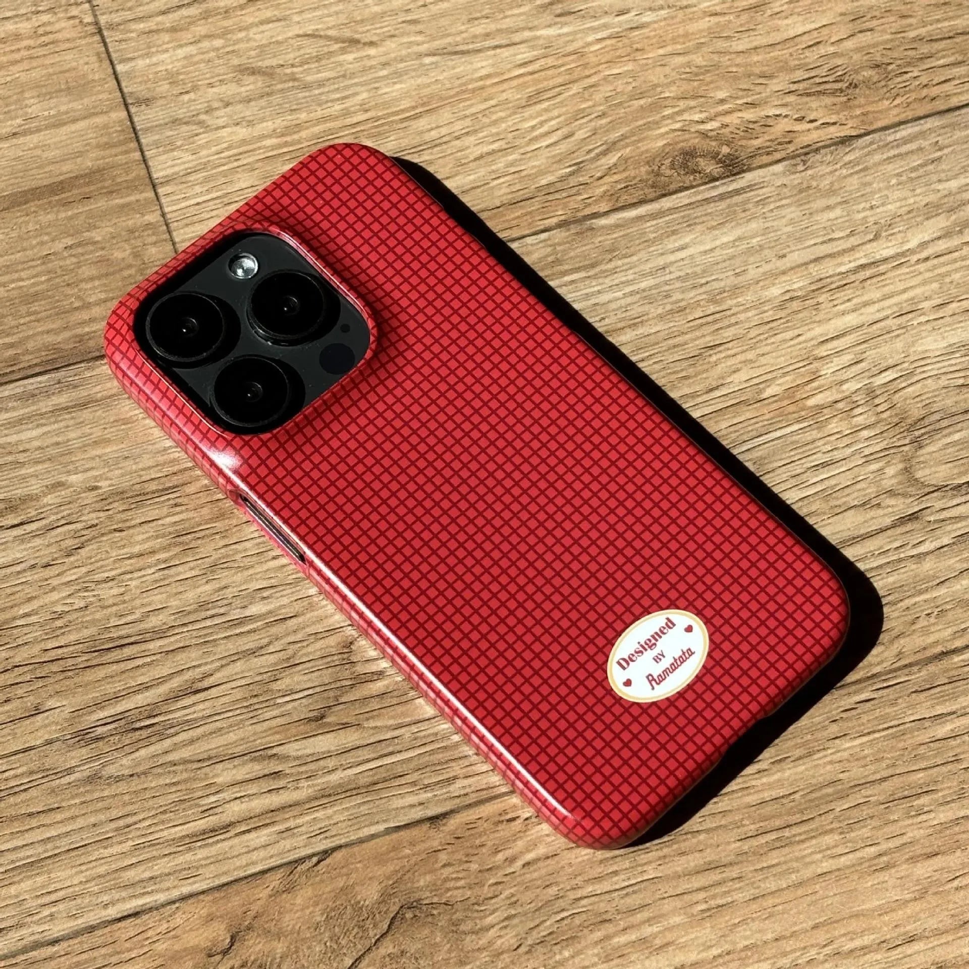 Anti-fingerprint plaid phone case for iPhone 15 Pro Max in red and orange pattern