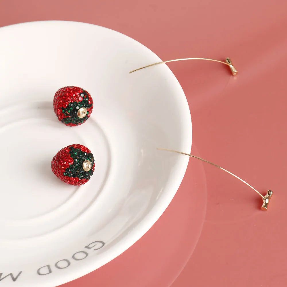Women's geometric strawberry earrings with spot drill detail in red zinc alloy.