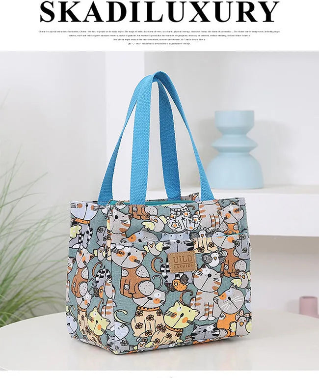 Women's printed canvas handbag with floral design and aluminium hardware in square shape
