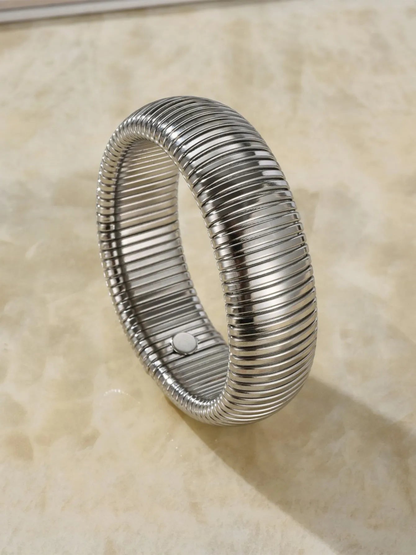 Women's elastic titanium steel bracelet with vertical stripe ring pattern in gold finish