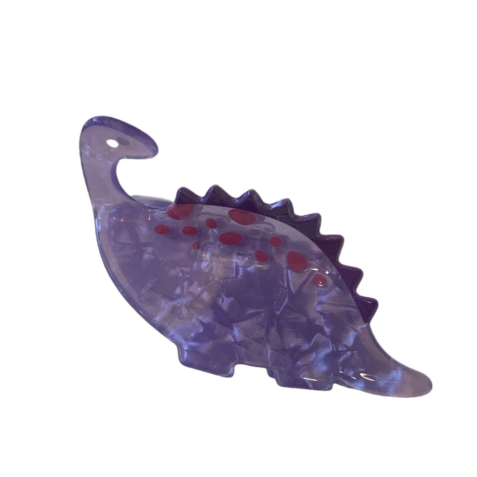 Dinosaur-themed acrylic jaw hair clip showing grip design with miniature dinosaur decoration